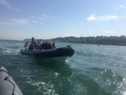Bow of Rocket Rib Charter with passengers at sea