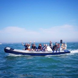 Group day out during the Cowes Torquay Cowes Powerboat race at sea